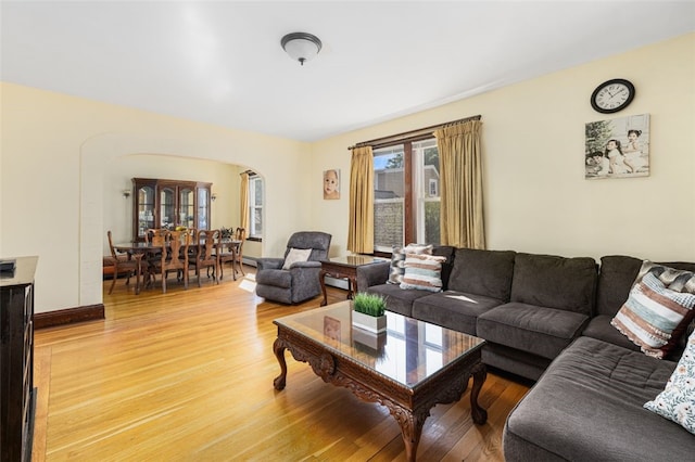 105 Overland Ave, Cranston, RI 02910 - living area featuring arched walkways and light wood-style flooring