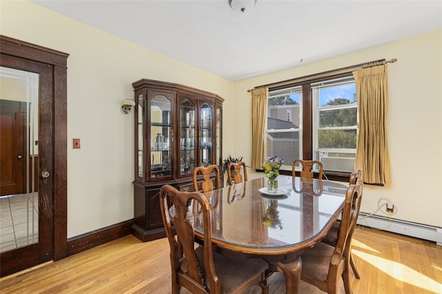 105 Overland Ave, Cranston, RI 02910 - dining room featuring light wood-style flooring, a baseboard heating unit, and cooling unit