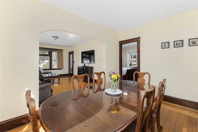 105 Overland Ave, Cranston, RI 02910 - dining area with arched walkways and wood-type flooring
