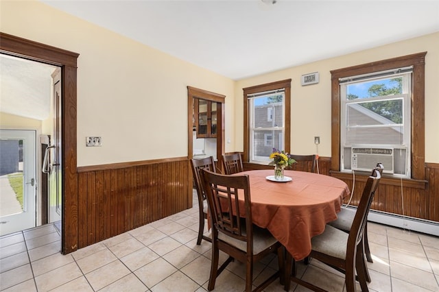 105 Overland Ave, Cranston, RI 02910 - dining room featuring a wainscoted wall, wood walls, cooling unit, light tile patterned floors, and baseboard heating
