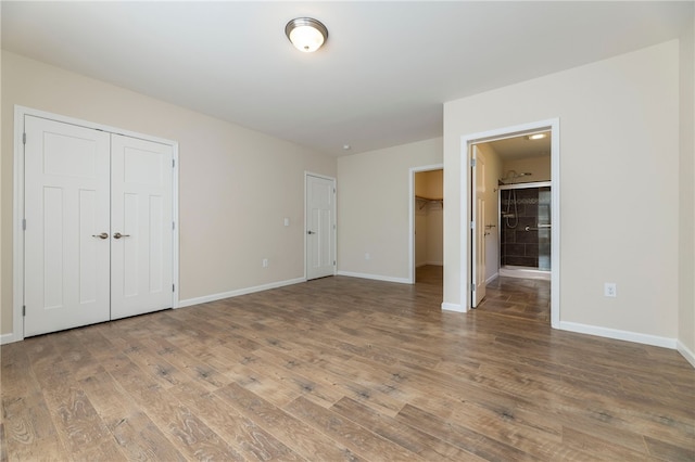 109 Chickadee Ln, South Kingstown, RI 02879 - unfurnished bedroom with wood finished floors and multiple closets