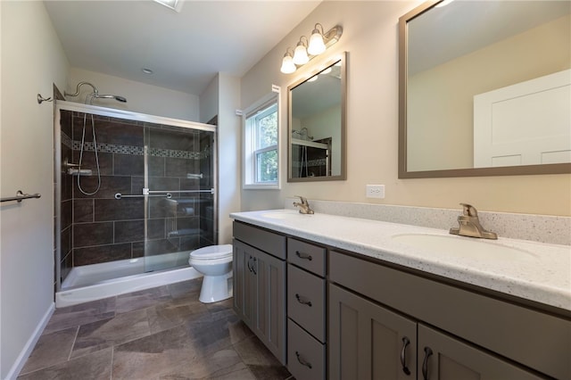 109 Chickadee Ln, South Kingstown, RI 02879 - bathroom featuring double vanity, a shower stall, and stone finish flooring