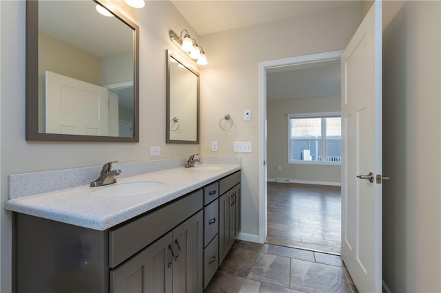 109 Chickadee Ln, South Kingstown, RI 02879 - bathroom with double vanity and baseboards