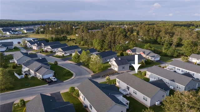 109 Chickadee Ln, South Kingstown, RI 02879 - aerial perspective of suburban area featuring a heavily wooded area and a nearby body of water