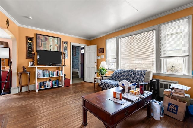 41 Higgins Ave, Providence, RI 02908 - living room with radiator heating unit, wood finished floors, crown molding, arched walkways, and stairs