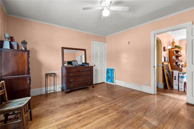 41 Higgins Ave, Providence, RI 02908 - bedroom with wood finished floors, ornamental molding, arched walkways, and ceiling fan