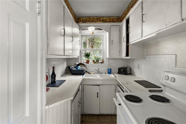 41 Higgins Ave, Providence, RI 02908 - kitchen featuring electric stove, backsplash, and light countertops
