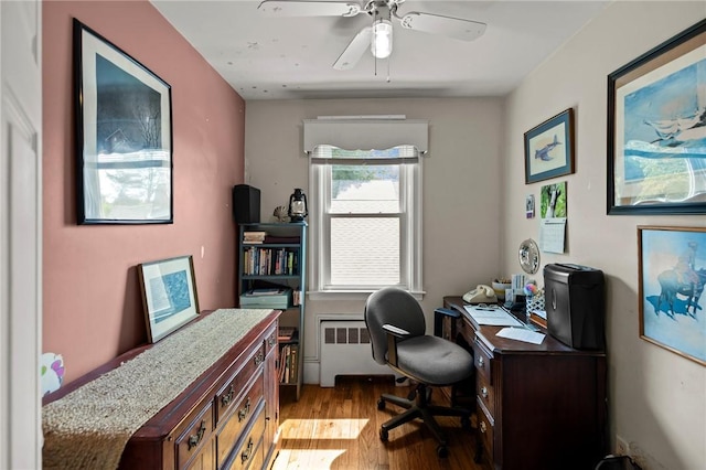 41 Higgins Ave, Providence, RI 02908 - office area featuring radiator heating unit, light wood-style floors, and ceiling fan