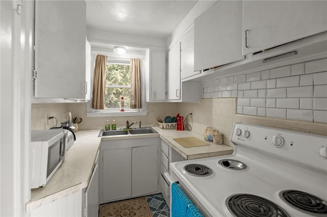 41 Higgins Ave, Providence, RI 02908 - kitchen featuring electric stove, light countertops, decorative backsplash, and dishwashing machine