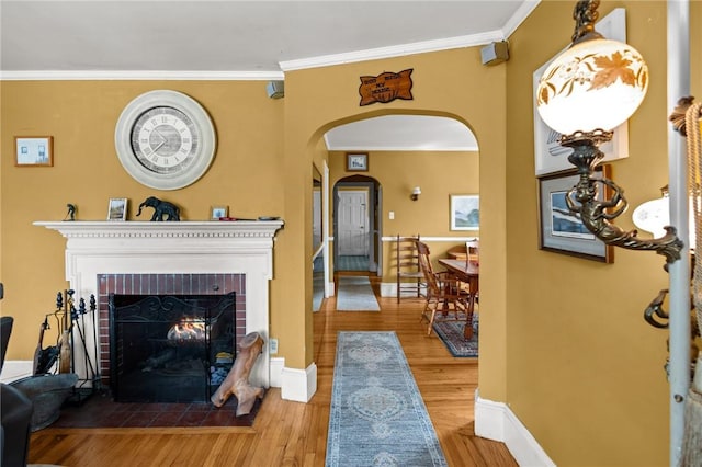 41 Higgins Ave, Providence, RI 02908 - living room with arched walkways, wood finished floors, ornamental molding, and a fireplace