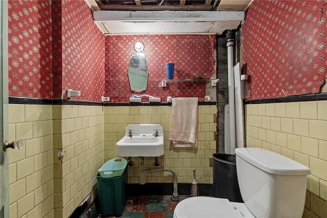 41 Higgins Ave, Providence, RI 02908 - bathroom featuring tile walls, wallpapered walls, and a wainscoted wall