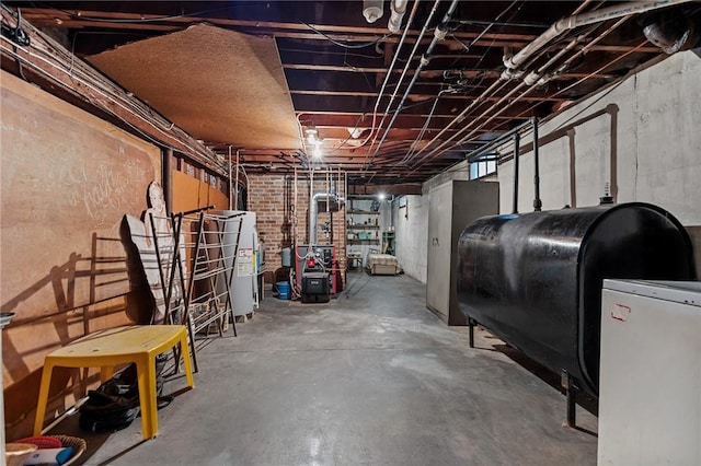 41 Higgins Ave, Providence, RI 02908 - unfinished below grade area featuring oil tank, water heater, and a heating unit