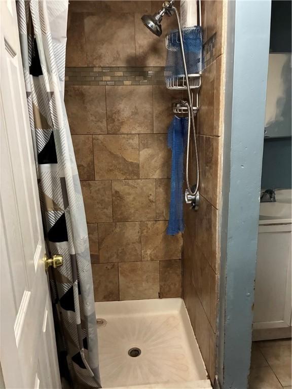 121 Murray St, Providence, RI 02909 - bathroom featuring a shower stall and tile patterned floors