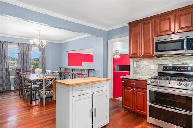 4 Linwood St, West Warwick, RI 02893 - kitchen with stainless steel appliances, dark wood-style floors, tasteful backsplash, a chandelier, and wood counters