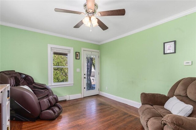 4 Linwood St, West Warwick, RI 02893 - living room with a baseboard heating unit, wood finished floors, crown molding, and ceiling fan