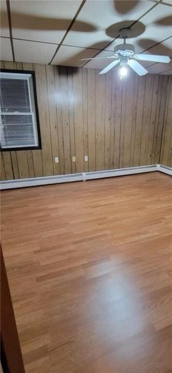 9 Octavia St, Providence, RI 02909 - spare room with wood finished floors, wood walls, and a ceiling fan