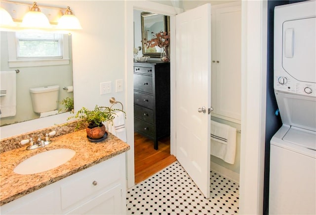 446 Bellevue Ave Unit 6, Newport, RI 02840 - bathroom featuring stacked washing machine and dryer and vanity