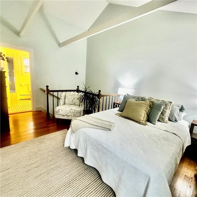 446 Bellevue Ave Unit 6, Newport, RI 02840 - bedroom featuring lofted ceiling, wood finished floors, and a baseboard heating unit
