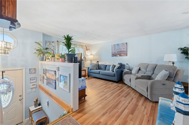 17 Cedar Dr, West Warwick, RI 02893 - living room featuring a chandelier, light wood-style floors, and plenty of natural light