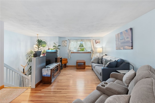 17 Cedar Dr, West Warwick, RI 02893 - living area with light wood-style floors and baseboards