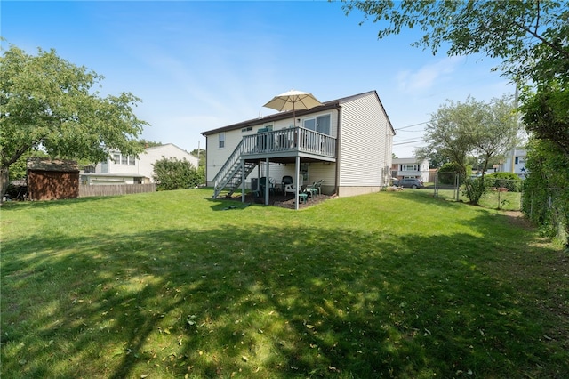 17 Cedar Dr, West Warwick, RI 02893 - rear view of house with stairway, a fenced backyard, a wooden deck, and a storage shed