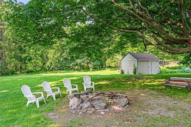 214 Highland Rd, Tiverton, RI 02878 - view of grassy yard featuring a fire pit and a shed