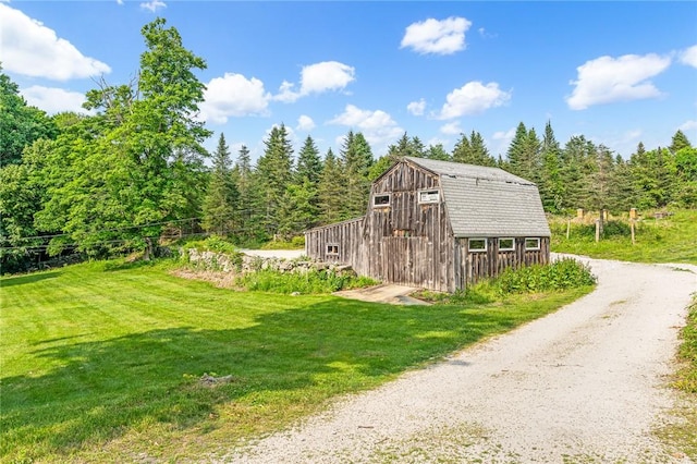 214 Highland Rd, Tiverton, RI 02878 - view of barn with a lawn, a view of trees, and driveway