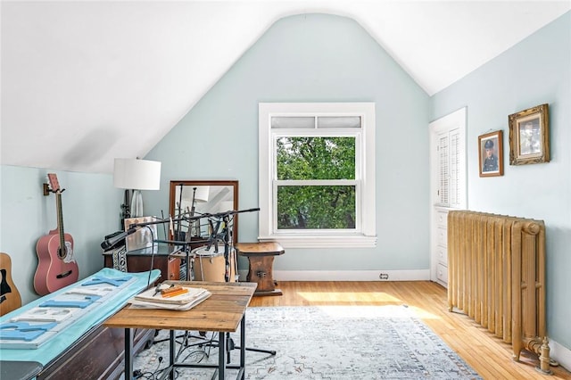 214 Highland Rd, Tiverton, RI 02878 - home office featuring radiator, light wood-type flooring, and lofted ceiling
