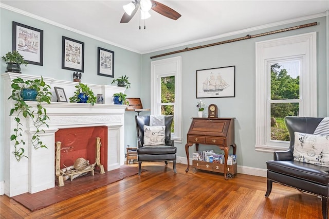 214 Highland Rd, Tiverton, RI 02878 - living area featuring hardwood / wood-style flooring, a ceiling fan, ornamental molding, and a fireplace with raised hearth