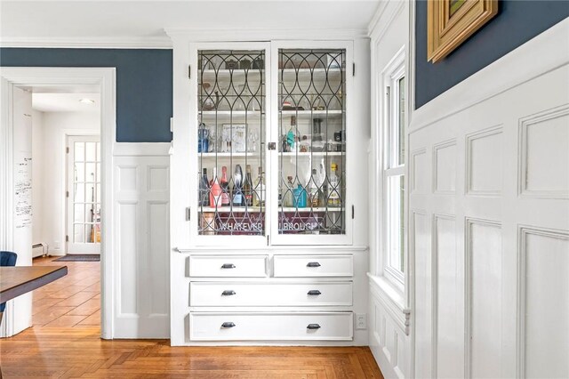 214 Highland Rd, Tiverton, RI 02878 - detailed view of crown molding and a baseboard radiator