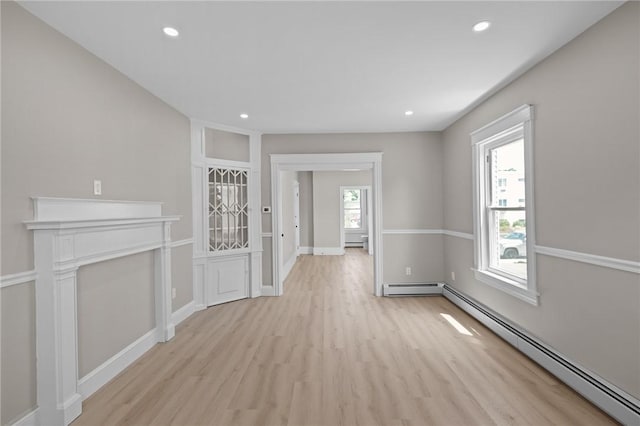 233 Waterman Ave, East Providence, RI 02914 - unfurnished living room with a baseboard radiator, baseboard heating, light wood finished floors, and recessed lighting
