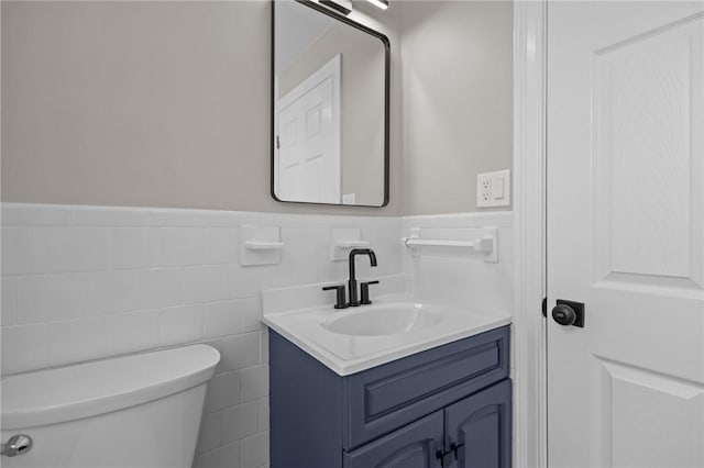 233 Waterman Ave, East Providence, RI 02914 - bathroom featuring vanity, a wainscoted wall, and tile walls