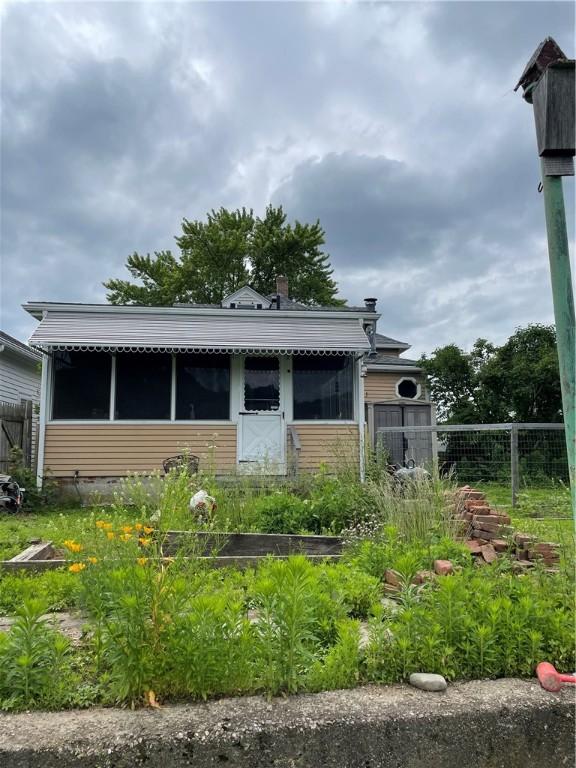 37 Kermit St, Woonsocket, RI 02895 - view of home's exterior with a sunroom