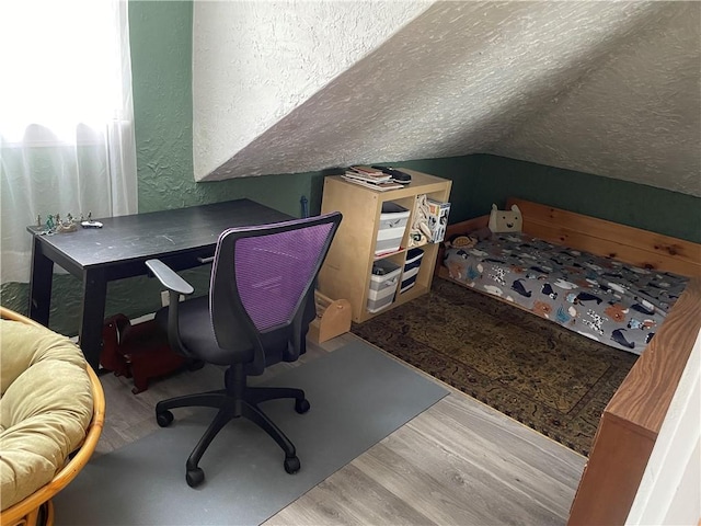 37 Kermit St, Woonsocket, RI 02895 - home office with wood finished floors, vaulted ceiling, a textured ceiling, and a textured wall