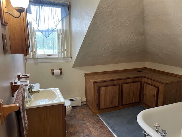 37 Kermit St, Woonsocket, RI 02895 - bathroom featuring a baseboard heating unit, vanity, and stone finish floors