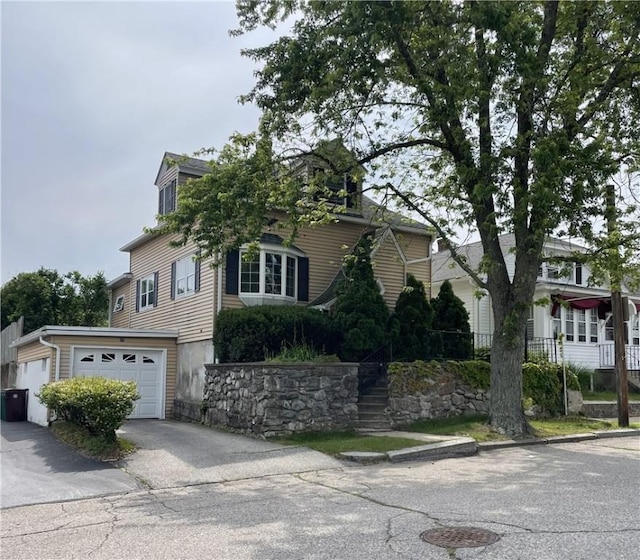 37 Kermit St, Woonsocket, RI 02895 - obstructed view of property featuring driveway