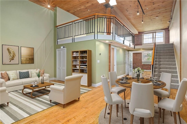 1 Tupperware Dr Unit 231, North Smithfield, RI 02896 - dining space with wooden ceiling, wood-type flooring, a towering ceiling, and stairway