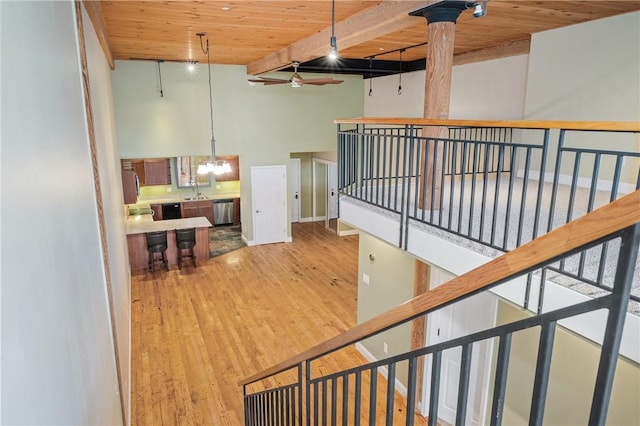 1 Tupperware Dr Unit 231, North Smithfield, RI 02896 - stairway with wooden ceiling, a chandelier, wood finished floors, and a high ceiling