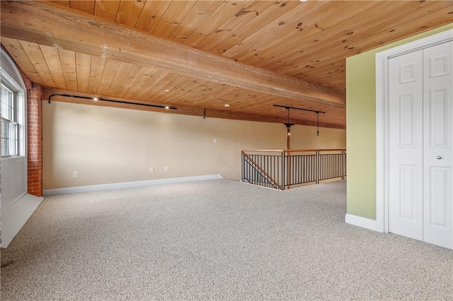 1 Tupperware Dr Unit 231, North Smithfield, RI 02896 - carpeted empty room with a wooden ceiling with exposed beams and baseboards
