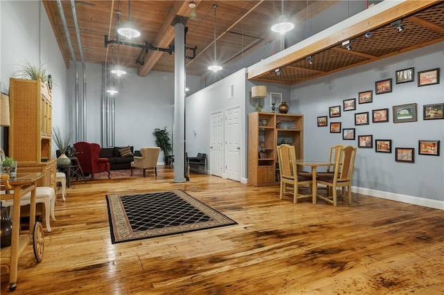 1 Tupperware Dr Unit 231, North Smithfield, RI 02896 - sitting room featuring a high ceiling, hardwood / wood-style floors, and beamed ceiling