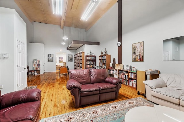 1 Tupperware Dr Unit 231, North Smithfield, RI 02896 - living area with high vaulted ceiling and hardwood / wood-style floors