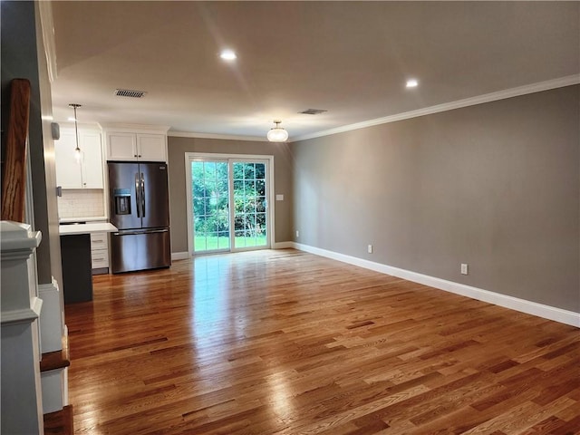3 Sutcliffe Ave, Lincoln, RI 02865 - unfurnished living room featuring crown molding, wood finished floors, and recessed lighting