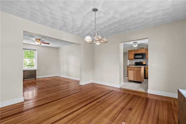 35 Inman Ave, Warwick, RI 02886 - unfurnished room featuring light wood-type flooring, a chandelier, and a ceiling fan