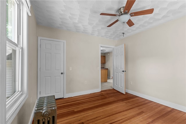 35 Inman Ave, Warwick, RI 02886 - unfurnished bedroom featuring light wood finished floors and a ceiling fan