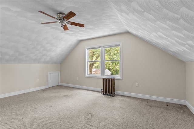 35 Inman Ave, Warwick, RI 02886 - bonus room with radiator heating unit, carpet, a ceiling fan, vaulted ceiling, and a textured ceiling