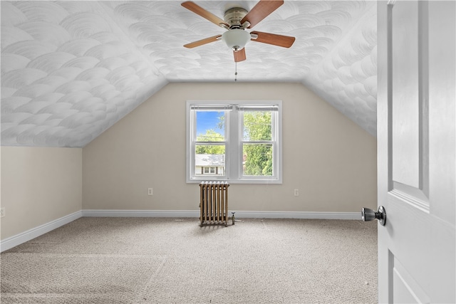 35 Inman Ave, Warwick, RI 02886 - bonus room featuring radiator heating unit, lofted ceiling, ceiling fan, and carpet flooring
