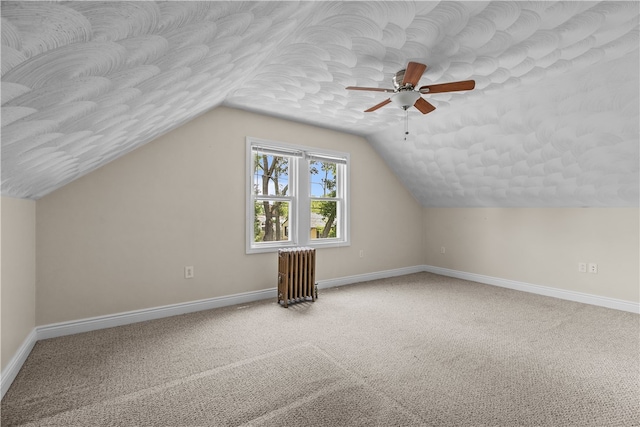 35 Inman Ave, Warwick, RI 02886 - additional living space with radiator heating unit, a ceiling fan, carpet flooring, and vaulted ceiling