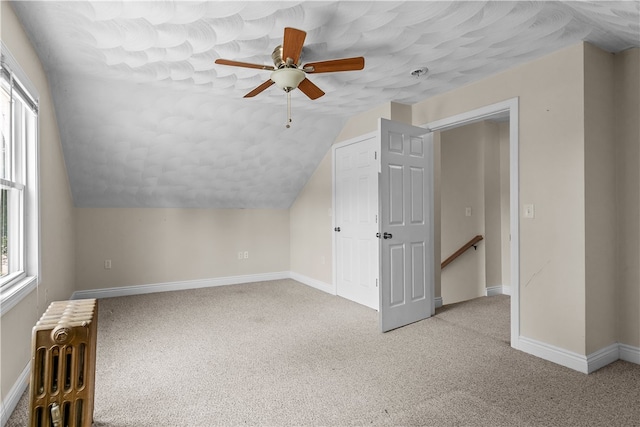 35 Inman Ave, Warwick, RI 02886 - bonus room featuring radiator heating unit, plenty of natural light, ceiling fan, carpet, and lofted ceiling