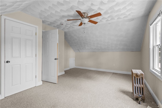 35 Inman Ave, Warwick, RI 02886 - bonus room featuring radiator, ceiling fan, lofted ceiling, and light colored carpet