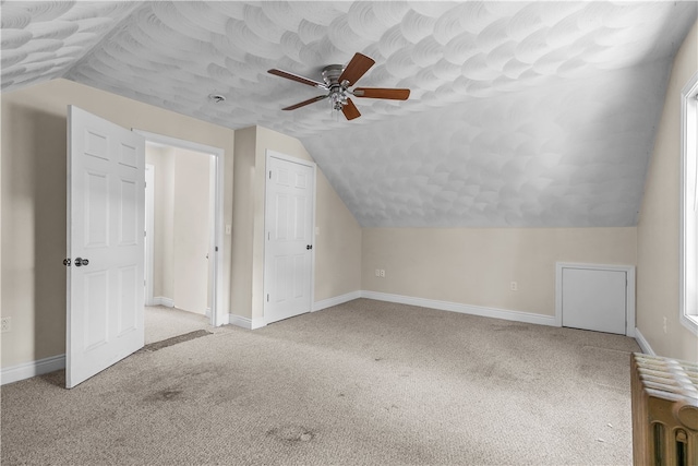 35 Inman Ave, Warwick, RI 02886 - additional living space with radiator heating unit, a ceiling fan, carpet flooring, and lofted ceiling